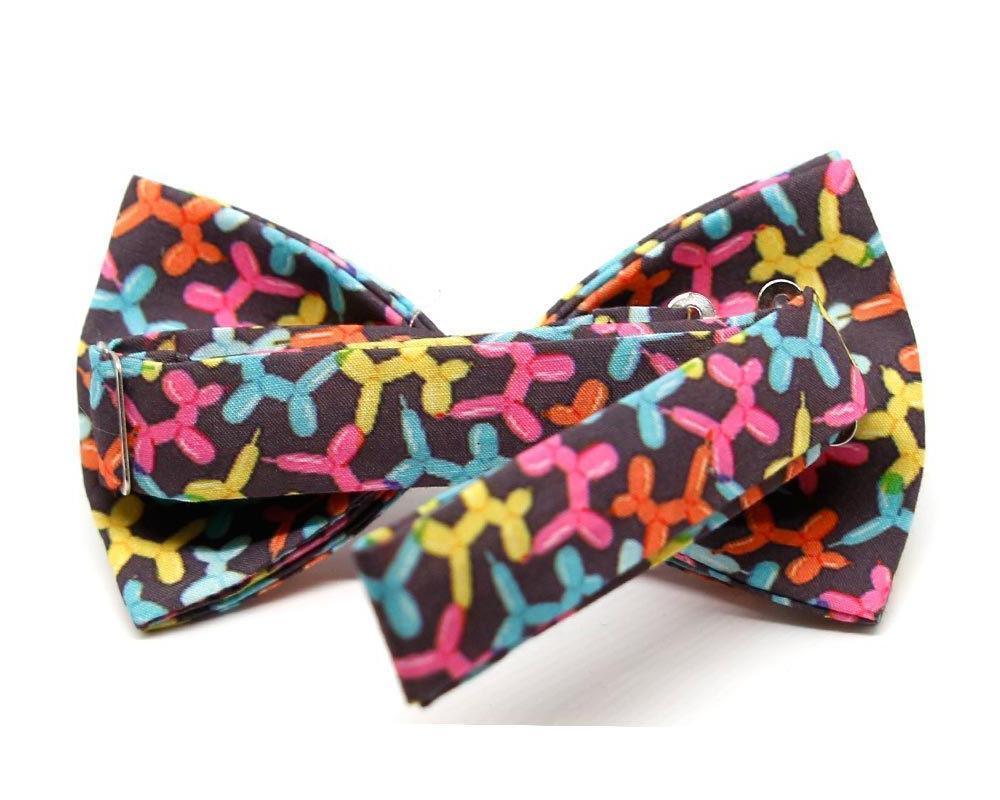 Pajarita negra con estampado colorido de globos de perros en rosa, azul, amarillo y naranja para hombre y niño